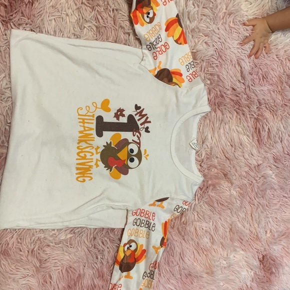 This is a SHEIN first thanksgiving long sleeve onesie. It buttons in the leg. - Picture 2 of 3